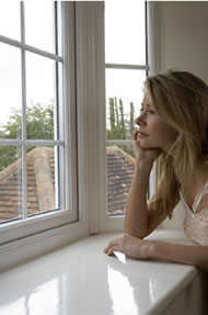 Woman looking out through a Deceuninck Upvc Window